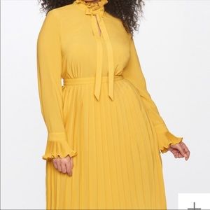 Beautiful Yellow Eloquii dress.